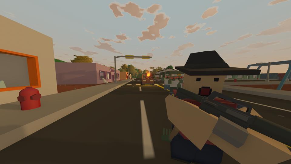 A player running in the foreground, closely chased by a horde of zombies.